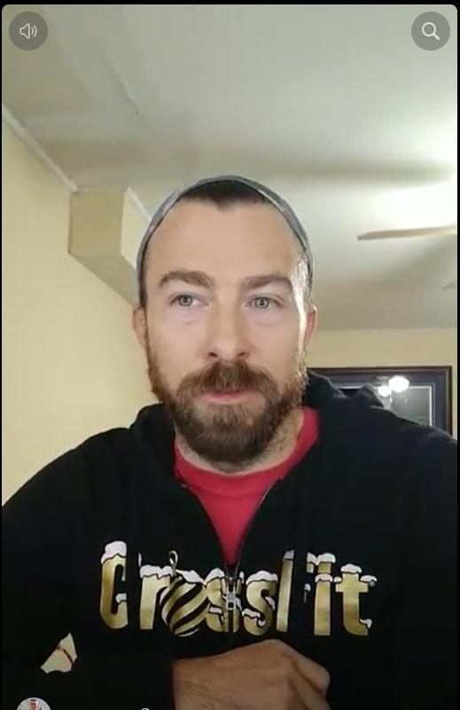 Adam Moore wearing a Crush It sweatshirt