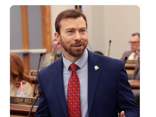 Adam Moore speaking in a House committee